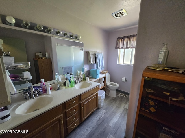 3204 W Viola Ave, Yakima, WA 98902 - bathroom featuring wood finished floors and double vanity