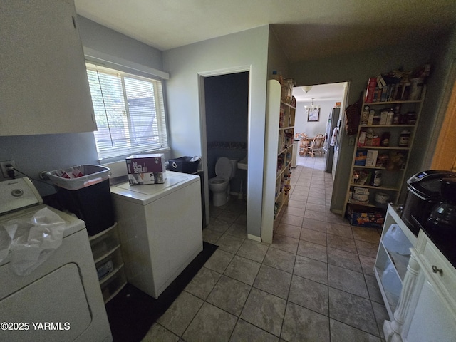 3204 W Viola Ave, Yakima, WA 98902 - laundry room featuring tile patterned flooring, a chandelier, and independent washer and dryer