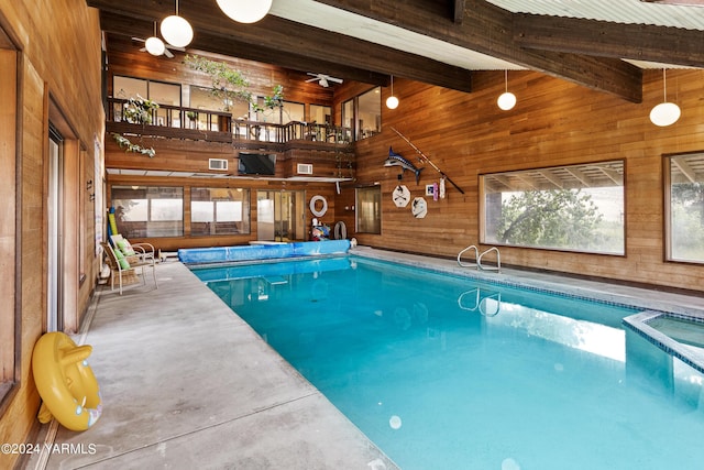 view of pool with a pool with connected hot tub