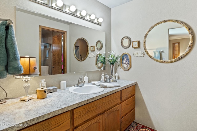 3012 S 79th Ave, Yakima, WA 98903 - bathroom featuring vanity, an enclosed shower, and a textured wall