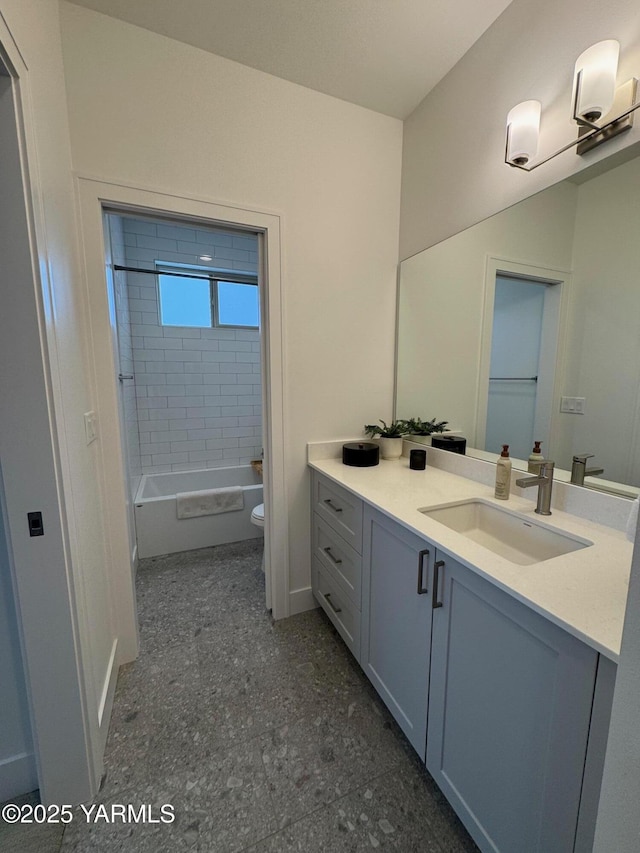 full bath featuring toilet, tub / shower combination, and vanity