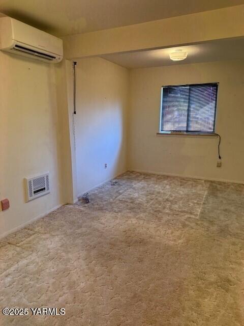 9 W Court St, Union Gap, WA 98903 - carpeted spare room featuring a wall mounted air conditioner