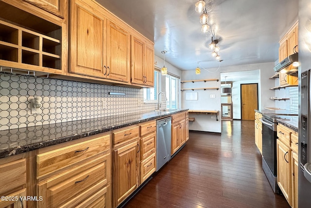 kitchen featuring decorative backsplash, hanging light fixtures, stainless steel appliances, open shelves, and a sink