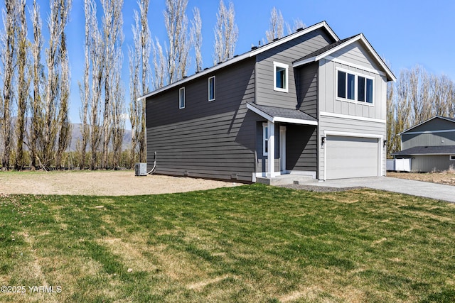 518 Chinook Winds Ln Lot 10, Tieton, WA 98947 - view of front facade featuring a garage, driveway, board and batten siding, and a front yard