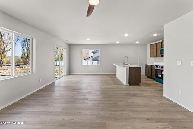 518 Chinook Winds Ln Lot 10, Tieton, WA 98947 - unfurnished living room featuring a ceiling fan, baseboards, a healthy amount of sunlight, and recessed lighting