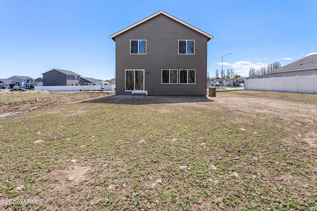 518 Chinook Winds Ln Lot 10, Tieton, WA 98947 - rear view of house featuring central AC unit, fence, and a patio
