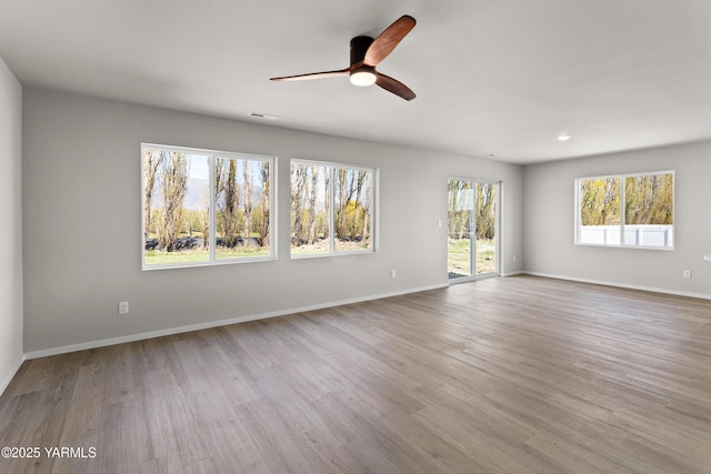 518 Chinook Winds Ln Lot 10, Tieton, WA 98947 - unfurnished living room with ceiling fan, baseboards, wood finished floors, and visible vents