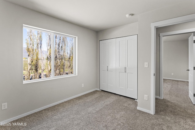 518 Chinook Winds Ln Lot 10, Tieton, WA 98947 - unfurnished bedroom featuring carpet floors, a closet, and baseboards