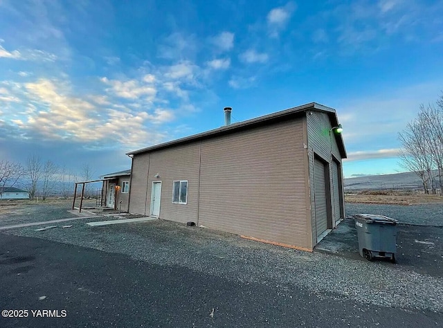 view of side of property featuring an outdoor structure