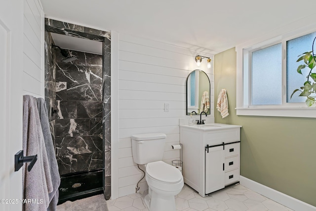 211 N 65th Pl, Yakima, WA 98908 - full bathroom featuring a stall shower, vanity, toilet, tile patterned flooring, and baseboards
