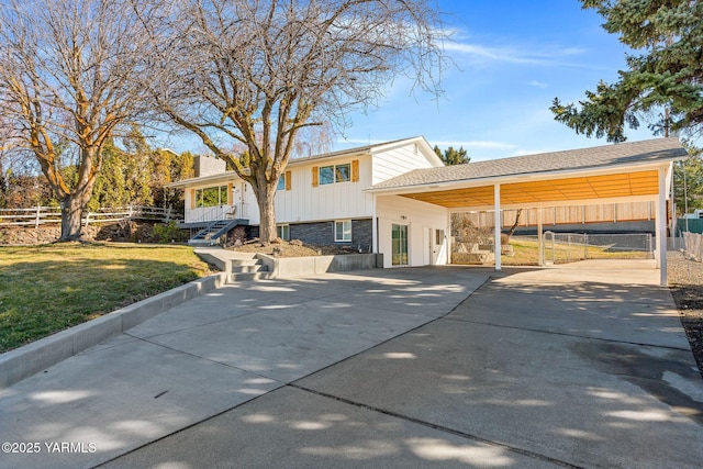 211 N 65th Pl, Yakima, WA 98908 - rear view of house featuring driveway and a carport