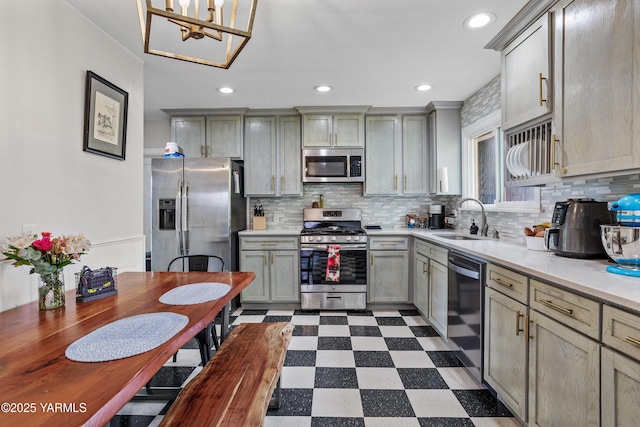 316 N 26th Ave, Yakima, WA 98902 - kitchen with stainless steel appliances, a sink, dark floors, gray cabinetry, and light countertops