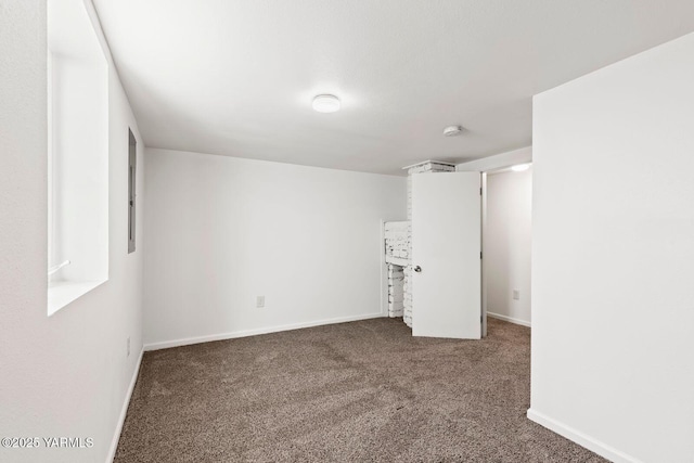 spare room with carpet floors and baseboards