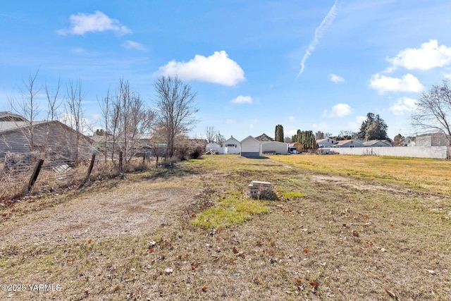 view of yard featuring a residential view and fence