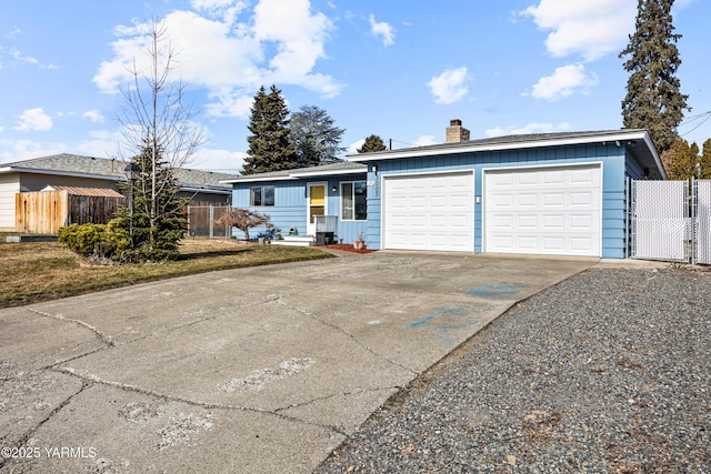 ranch-style house featuring concrete driveway, a chimney, an attached garage, a gate, and fence