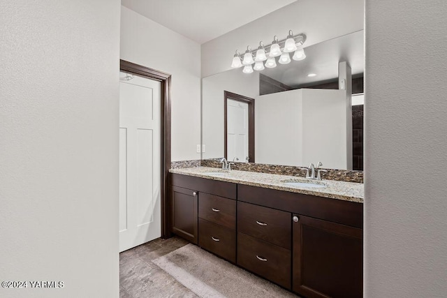 bathroom featuring double vanity and a sink