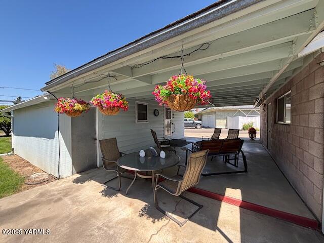 908 W 5th St, Grandview, WA 98930 - view of patio featuring outdoor dining area