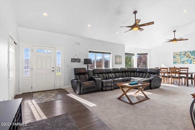 living room with high vaulted ceiling, dark wood-style flooring, and recessed lighting