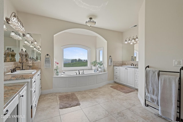 1893 Young Grade Rd, Yakima, WA 98908 - full bathroom with two vanities, tile patterned flooring, a bath, and baseboards