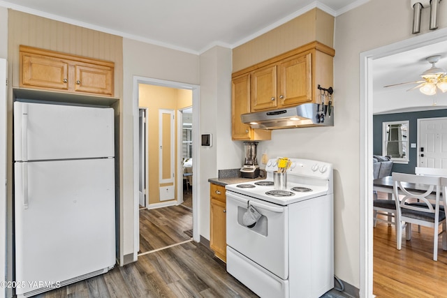 kitchen featuring dark wood-style flooring, dark countertops, ornamental molding, white appliances, and under cabinet range hood