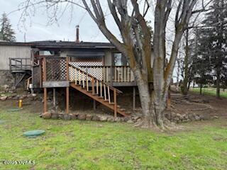 8108 Poplar View Way, Yakima, WA 98908 - back of house with a wooden deck, stairs, and a yard