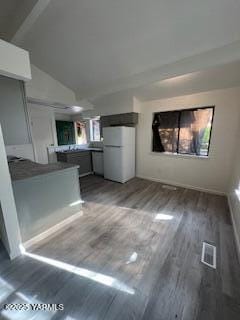 8108 Poplar View Way, Yakima, WA 98908 - unfurnished living room with wood finished floors and vaulted ceiling