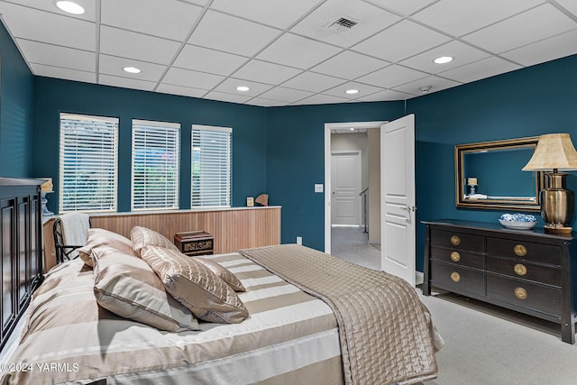 bedroom with recessed lighting, visible vents, and a drop ceiling