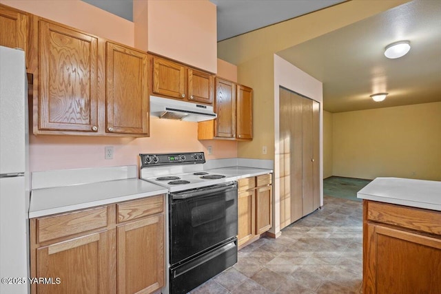 308 Merrick Ave, Sunnyside, WA 98944 - kitchen featuring electric stove, under cabinet range hood, freestanding refrigerator, and light countertops