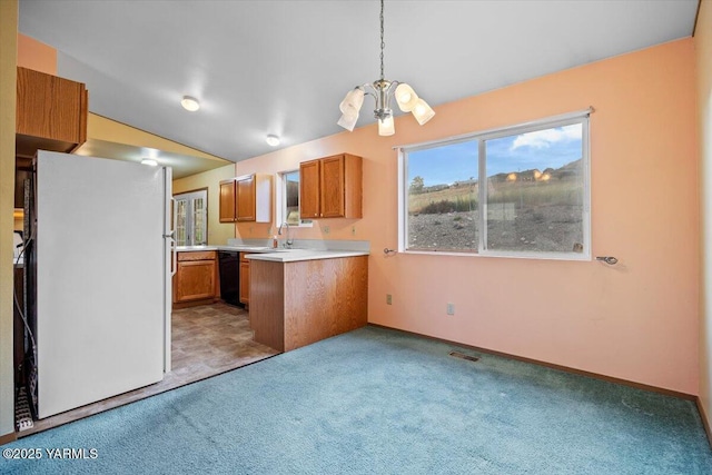 308 Merrick Ave, Sunnyside, WA 98944 - kitchen featuring freestanding refrigerator, brown cabinets, light carpet, black dishwasher, and lofted ceiling