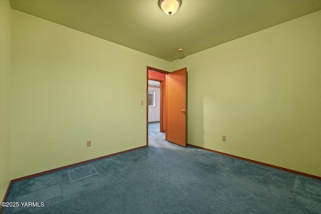 308 Merrick Ave, Sunnyside, WA 98944 - unfurnished room featuring carpet and baseboards