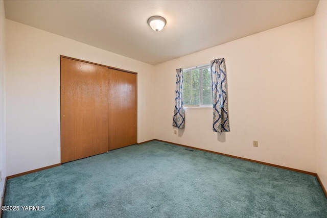 308 Merrick Ave, Sunnyside, WA 98944 - unfurnished bedroom featuring carpet, baseboards, and a closet