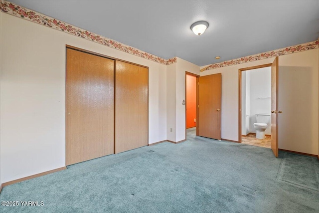 308 Merrick Ave, Sunnyside, WA 98944 - unfurnished bedroom with a closet, carpet, connected bathroom, and baseboards