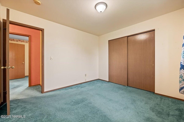 308 Merrick Ave, Sunnyside, WA 98944 - unfurnished bedroom with carpet, baseboards, and a closet