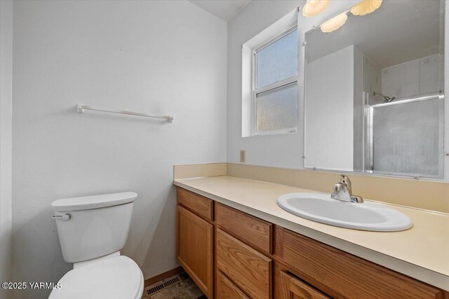 308 Merrick Ave, Sunnyside, WA 98944 - bathroom featuring vanity, toilet, and an enclosed shower