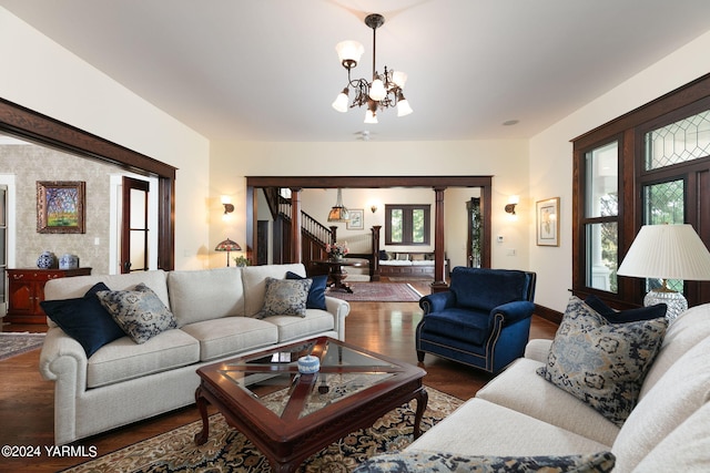 living room with baseboards, stairway, dark wood finished floors, and a chandelier