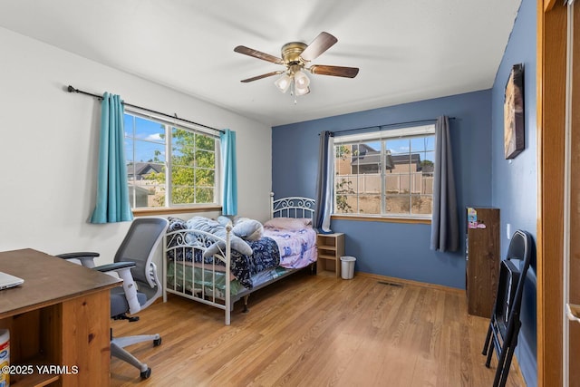 7501 Glacier Way, Yakima, WA 98908 - bedroom with wood finished floors, an office area, and ceiling fan
