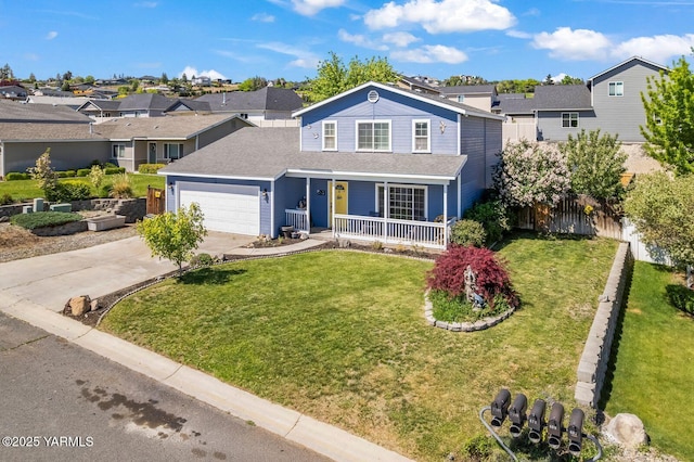 7501 Glacier Way, Yakima, WA 98908 - traditional home with a porch, a residential view, concrete driveway, an attached garage, and a shingled roof