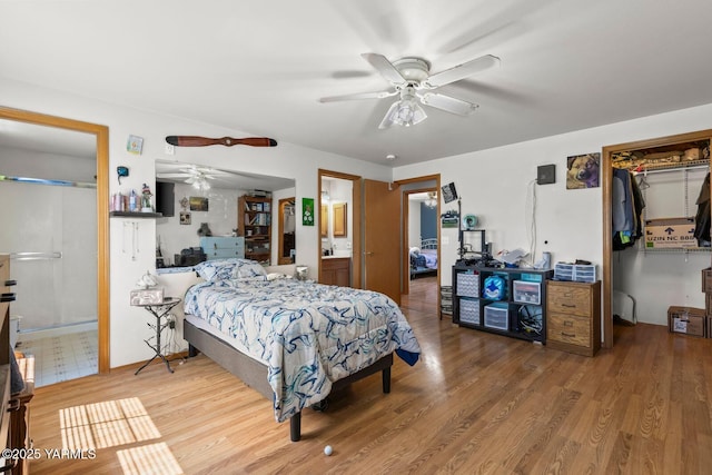 7501 Glacier Way, Yakima, WA 98908 - bedroom featuring a spacious closet, a closet, wood finished floors, ensuite bathroom, and a ceiling fan