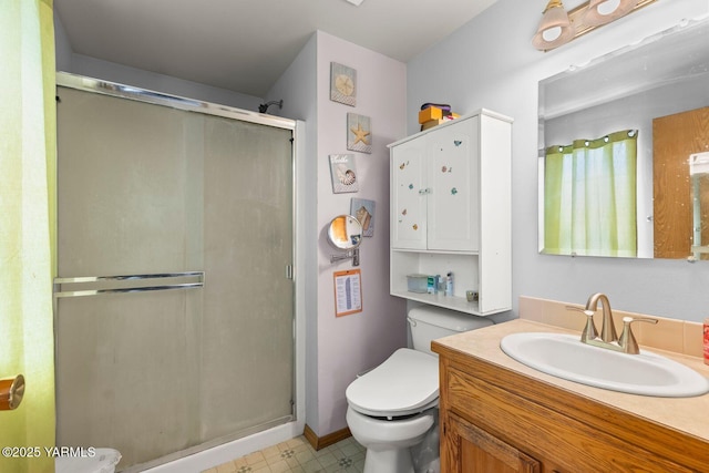 7501 Glacier Way, Yakima, WA 98908 - bathroom featuring a stall shower, toilet, vanity, and tile patterned floors