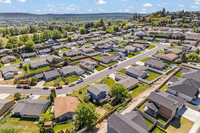 7501 Glacier Way, Yakima, WA 98908 - aerial perspective of suburban area with property boundaries highlighted and a mountainous background