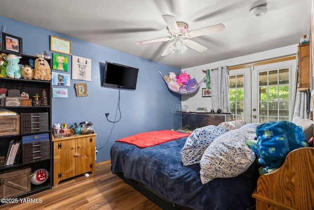 7501 Glacier Way, Yakima, WA 98908 - bedroom featuring wood finished floors, french doors, access to exterior, and ceiling fan