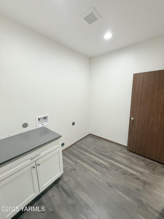 121 Lyle Loop Rd, Selah, WA 98942 - washroom featuring cabinet space, hookup for a washing machine, and dark wood-style floors