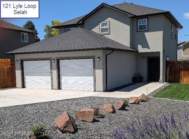 121 Lyle Loop Rd, Selah, WA 98942 - view of front of property featuring a garage, concrete driveway, and stucco siding