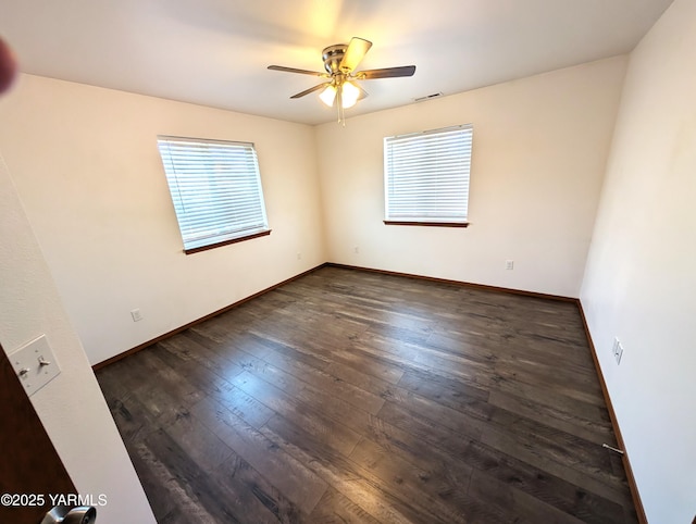 121 Lyle Loop Rd, Selah, WA 98942 - empty room featuring healthy amount of natural light, dark wood-style flooring, and ceiling fan