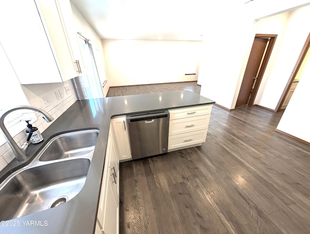 121 Lyle Loop Rd, Selah, WA 98942 - kitchen with dishwasher, dark countertops, dark wood-style floors, white cabinetry, and a peninsula