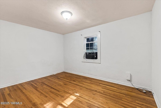 509 N 32nd Ave, Yakima, WA 98902 - unfurnished room featuring wood finished floors, cooling unit, and a textured ceiling