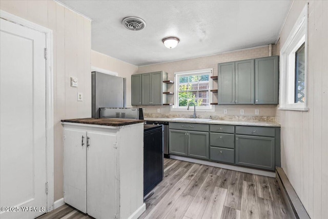 509 N 32nd Ave, Yakima, WA 98902 - kitchen featuring open shelves, light wood-style flooring, and gray cabinets