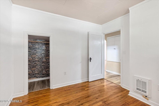 509 N 32nd Ave, Yakima, WA 98902 - unfurnished bedroom with wood finished floors, heating unit, and ensuite bath