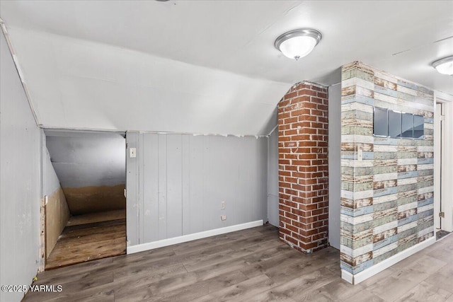 509 N 32nd Ave, Yakima, WA 98902 - additional living space with wood finished floors, vaulted ceiling, and wood walls