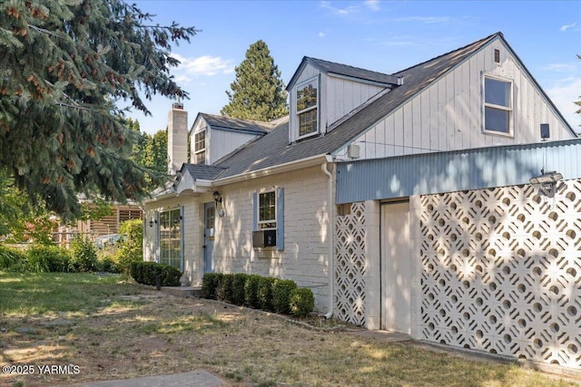 509 N 32nd Ave, Yakima, WA 98902 - view of home's exterior featuring a chimney, a yard, and roof with shingles